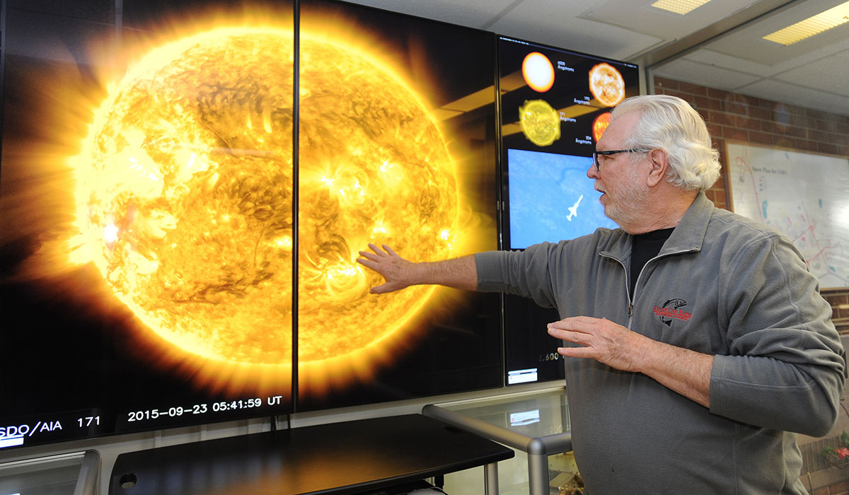 Researcher studying sun