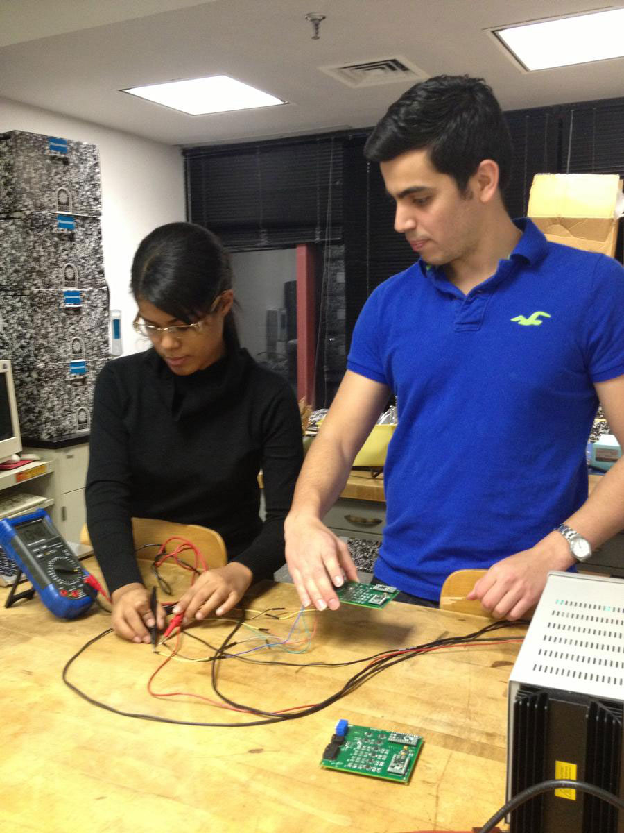 Male and female student working on project